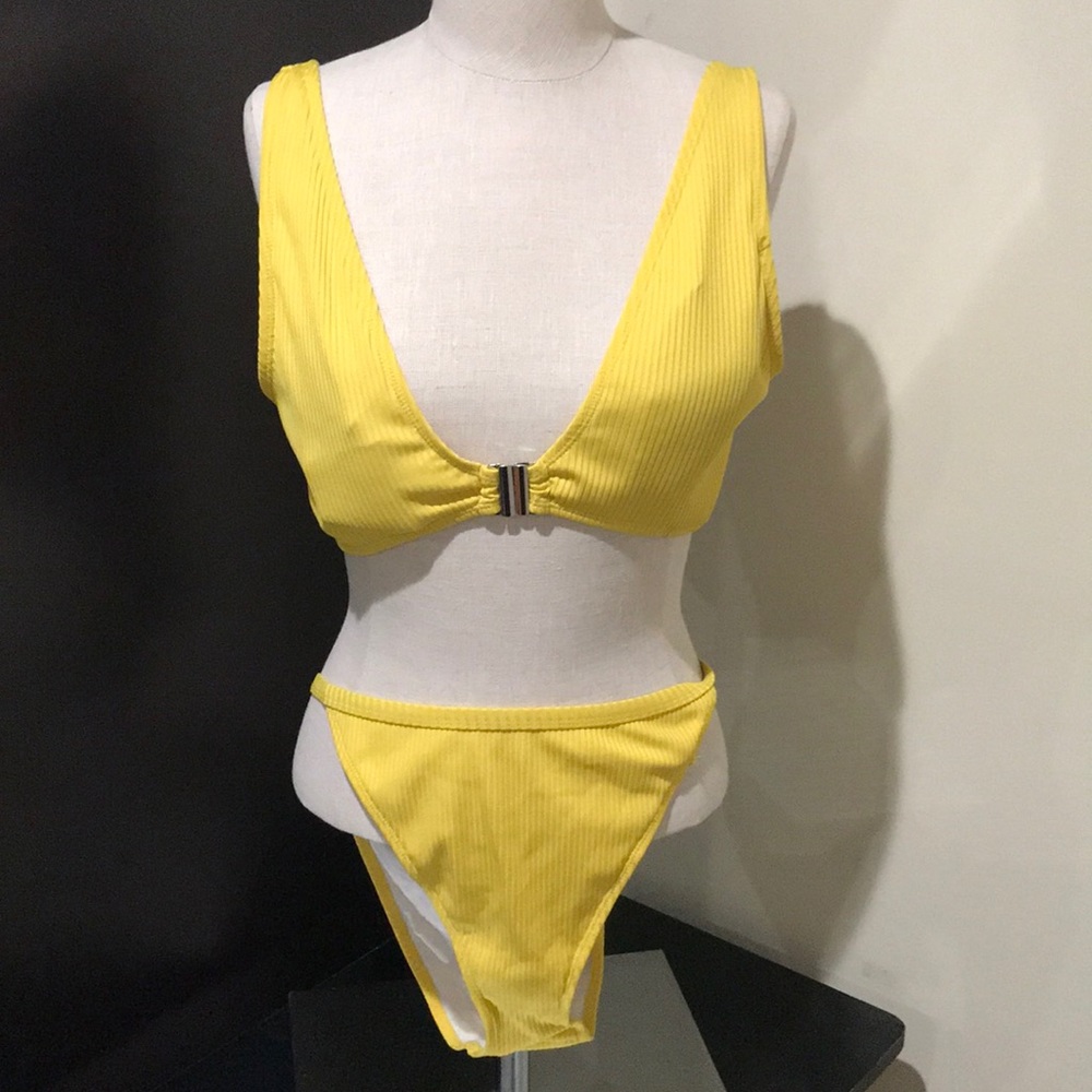 Yellow swim suit (two pieces) worn once.